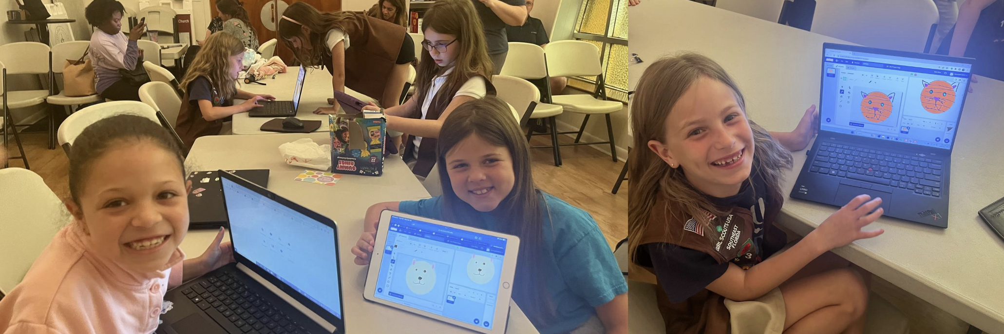 Girls smiling and coding at workshop